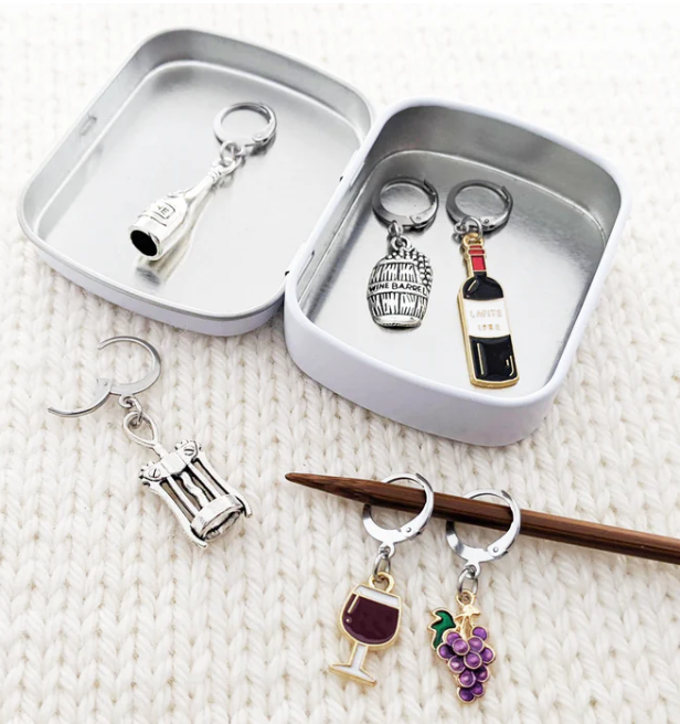 Crochet stitch markers with storage tin