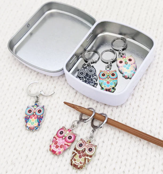 Crochet stitch markers with storage tin