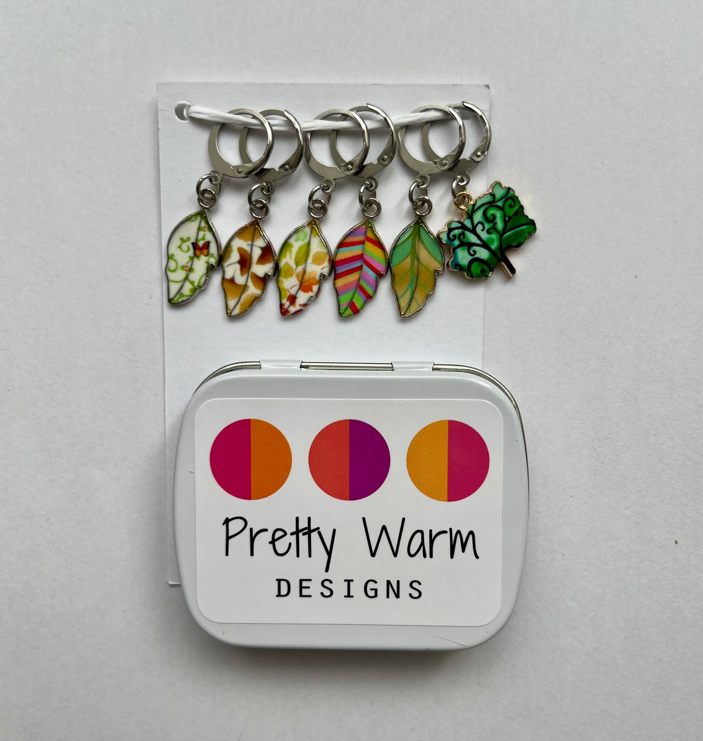 Crochet stitch markers with storage tin